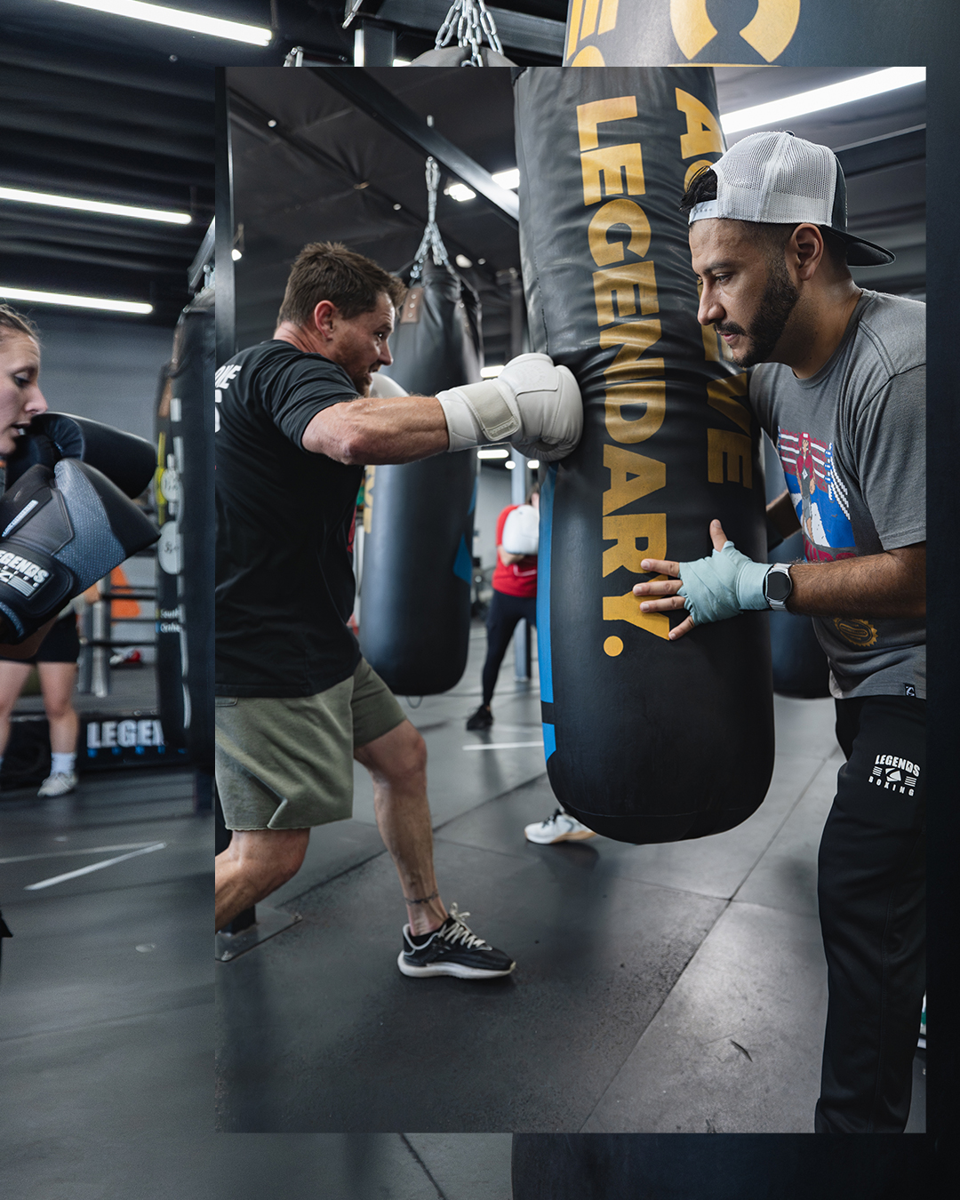 Coach demonstrating real technique on the heavy bag